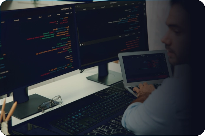 Developer working across multiple screens